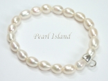 White Oval Pearl Bracelet with Charm Carrier