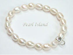 White Oval Pearl Bracelet with Charm Carrier